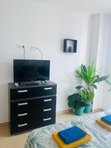 TV a/nebo společenská místnost v ubytování Apartamento de Ensueño
