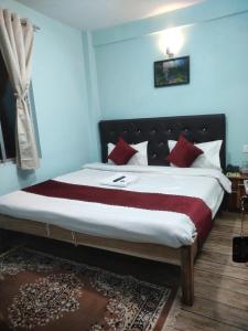 Postel nebo postele na pokoji v ubytování Hotel Pearl Retreat