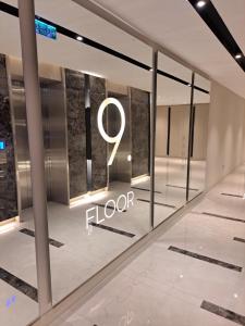 a lobby with a sign that reads floor at Anika Luxury apartment at Diamond center in Skopje