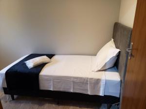 Ένα ή περισσότερα κρεβάτια σε δωμάτιο στο Casa na Pousada Hortelã Pimenta