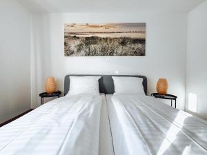 Postel nebo postele na pokoji v ubytování Schiller-Quartier 6