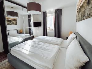 Postel nebo postele na pokoji v ubytování Schiller-Quartier 6