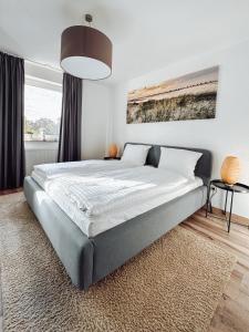 Postel nebo postele na pokoji v ubytování Schiller-Quartier 6