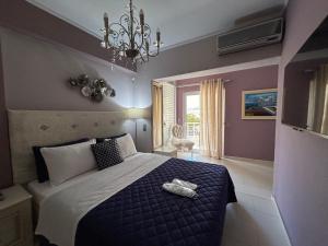 Postel nebo postele na pokoji v ubytování Palataki Residence
