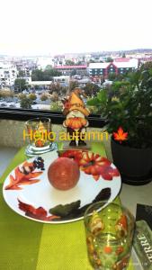 a plate of food on a table with a view at View in Skopje