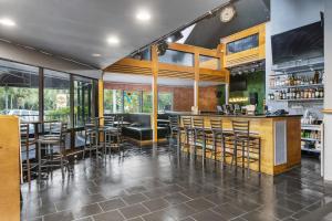 a bar in a restaurant with chairs and tables at Sun Fun Hotel in Nassau