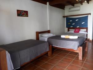 Postel nebo postele na pokoji v ubytování Hostal Surfers Paradise
