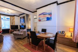 a living room with a table and a couch at Londonderry House in Stockton-on-Tees
