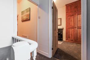 a hallway with a door leading into a room with a closet at Londonderry House in Stockton-on-Tees