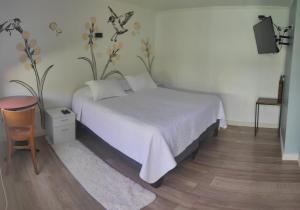 Un ou plusieurs lits dans un hébergement de l'établissement HOSTAL LA MODERNA