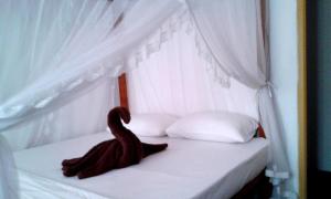Letto o letti in una camera di Sunstyle Mirissa Guest House