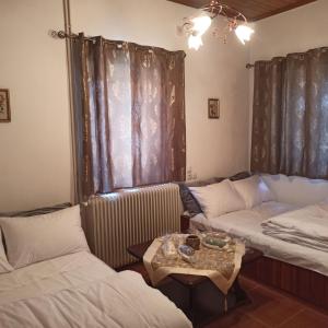 Postel nebo postele na pokoji v ubytování Anilio House