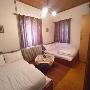 Postel nebo postele na pokoji v ubytování Anilio House