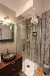 a bathroom with a sink and a shower at La Dolce Vita Civitavecchia in Civitavecchia +101 photos