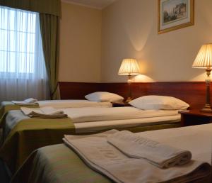 Кровать или кровати в номере Hotel Batory