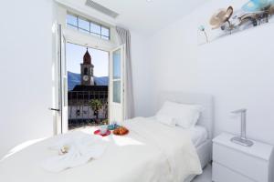 Letto o letti in una camera di Yellow View Apartment - Happy Rentals