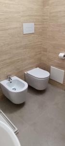 a bathroom with a toilet and a bidet and a sink at All inBasilicata Bed & Breakfast in Baragiano +55 photos