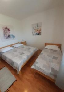 Postel nebo postele na pokoji v ubytování Apartment Kosta