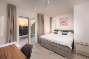 Ένα ή περισσότερα κρεβάτια σε δωμάτιο στο Apartments 01 Promajna +37 φωτογραφίες