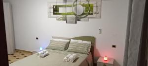 A bed or beds in a room at All inBasilicata Bed & Breakfast