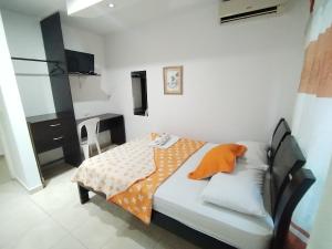 TV a/nebo společenská místnost v ubytování Hotel La Leyenda Vallenata