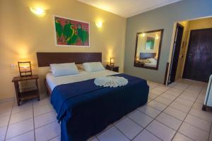 Postel nebo postele na pokoji v ubytování Porto Zarpa Hotel + 37 fotografií