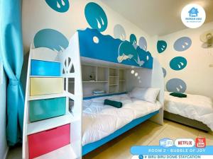 a childs bedroom with a bunk bed in a room at Spacious Theme Villa w BBQ-Game On-KTV in Johor Bahru in Iskandar Puteri