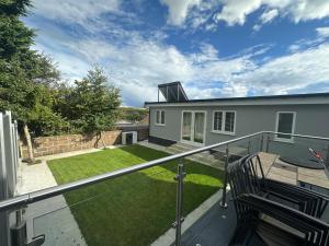 a balcony with a view of a yard at Private Holiday Home, Great Location in Brighton & Hove
