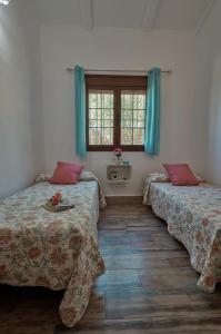 A bed or beds in a room at Rincón de Marco y María