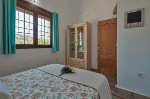 A bed or beds in a room at Rincón de Marco y María