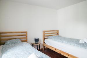 Ένα ή περισσότερα κρεβάτια σε δωμάτιο στο Nimbuzzz Apartments