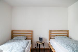 Ένα ή περισσότερα κρεβάτια σε δωμάτιο στο Nimbuzzz Apartments