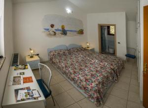 Un pat sau paturi într-o cameră la Il Giardino di Valentina