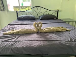 Postel nebo postele na pokoji v ubytování Janzo House