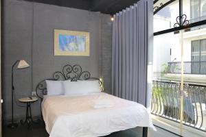 Postel nebo postele na pokoji v ubytování Lavender Hotel 202 - Nam Đuống, Thượng Thanh, Long Biên