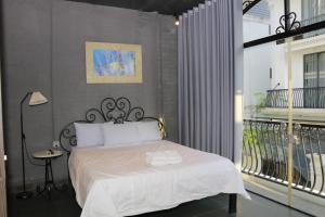Postel nebo postele na pokoji v ubytování Lavender Hotel 202 - Nam Đuống, Thượng Thanh, Long Biên