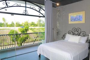 Postel nebo postele na pokoji v ubytování Lavender Hotel 202 - Nam Đuống, Thượng Thanh, Long Biên