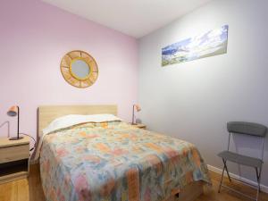 a bedroom with a bed and a mirror and a chair at À Loudenvielle, T2 moderne, proche télécabine, parking, wifi - FR-1-695-61 in Loudenvielle