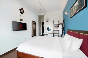 Postel nebo postele na pokoji v ubytování A25 Hotel - 197 Thanh Nhàn