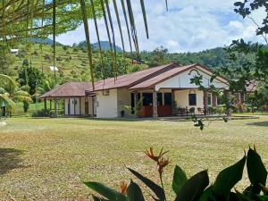 a house with a large yard in front of it at Lemuni Retreat & Training Centre - Kerling, Selangor in Kerling