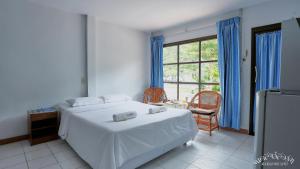 Postel nebo postele na pokoji v ubytování HaadSon Resort