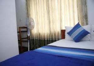 Postel nebo postele na pokoji v ubytování Ivory Safari House