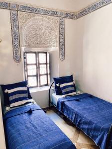 Postel nebo postele na pokoji v ubytování Riad Sidi Radoine + 37 fotografií