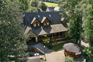 an aerial view of a large house with a roof at Pension Restaurant Bobrovník in Lipova Lazne
