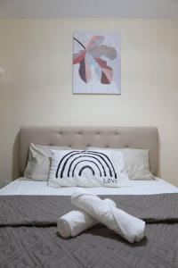 Postel nebo postele na pokoji v ubytování Skyline Home Antipolo