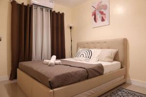 Postel nebo postele na pokoji v ubytování Skyline Home Antipolo