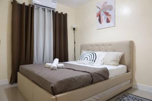 Postel nebo postele na pokoji v ubytování Skyline Home Antipolo