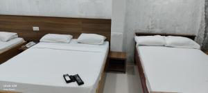 Postel nebo postele na pokoji v ubytování Hotel GARISHPARK