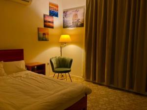 Postel nebo postele na pokoji v ubytování 411Motel