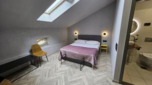 Postel nebo postele na pokoji v ubytování Hotel Amfiteatar